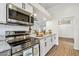 Kitchen with updated countertops, stainless steel appliances, and ample counter space at 6680 67Th N Way, Pinellas Park, FL 33781