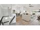 Bright living room featuring an open floor plan, stylish furnishings, and wood-look floors at 6680 67Th N Way, Pinellas Park, FL 33781