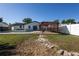 Spacious backyard with a refreshing pool and an elegant pergola perfect for outdoor relaxation and entertaining at 724 Tradewinds Dr, Brandon, FL 33511