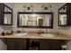 Bathroom with double sinks and decorative lighting fixtures at 724 Tradewinds Dr, Brandon, FL 33511
