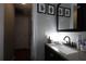 Bathroom with granite counters, bright lighting, and decorative wall art at 724 Tradewinds Dr, Brandon, FL 33511