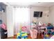 Bright bedroom featuring playful decor, toys, wood floors, and natural light at 724 Tradewinds Dr, Brandon, FL 33511