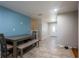 Cozy dining area featuring a wooden table with bench seating and view of the front door at 724 Tradewinds Dr, Brandon, FL 33511