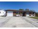 Charming single-story brick home with attached garage and spacious concrete driveway at 724 Tradewinds Dr, Brandon, FL 33511