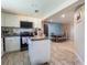 Bright, updated kitchen with granite countertops, white cabinets, and black appliances at 724 Tradewinds Dr, Brandon, FL 33511