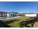 Relaxing backyard with a sparkling pool and pergola providing shade and style for outdoor lounging at 724 Tradewinds Dr, Brandon, FL 33511