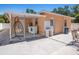 Backyard featuring laundry setup, seating and minimalist decor at 8210 Marigold Ave, Tampa, FL 33614