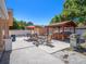 Spacious backyard with outdoor kitchen, seating area, and lush landscaping at 8210 Marigold Ave, Tampa, FL 33614