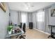 Well-lit office space with tile floors, a glass desk, and large windows with natural light at 8210 Marigold Ave, Tampa, FL 33614