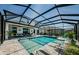 Screened pool and patio area featuring a covered patio with ceiling fans and comfortable seating at 8314 Capstone Ranch Dr, New Port Richey, FL 34655