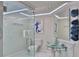 Elegant bathroom featuring a glass shower, modern vanity with glass sink, and stylish decor at 1093 Muirfield Ct, Tarpon Springs, FL 34688
