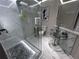 Contemporary bathroom with a glass-enclosed shower, sleek fixtures, and modern vanity at 1093 Muirfield Ct, Tarpon Springs, FL 34688