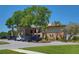 Spacious clubhouse with ample parking and landscaping for a luxurious community experience at 1093 Muirfield Ct, Tarpon Springs, FL 34688