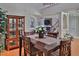 Formal dining room features hardwood floors, and direct access to a living room fireplace at 1093 Muirfield Ct, Tarpon Springs, FL 34688