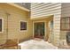 Inviting entrance with decorative doors and a tiled patio area, perfect for outdoor relaxation at 1093 Muirfield Ct, Tarpon Springs, FL 34688