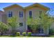 Charming townhouse showcasing an outdoor patio perfect for relaxing or entertaining guests at 1093 Muirfield Ct, Tarpon Springs, FL 34688