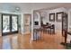 Elegant foyer with hardwood floors, showcasing the open layout to the living and dining areas of the home at 1093 Muirfield Ct, Tarpon Springs, FL 34688