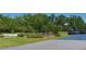 Picturesque golf course with golf carts, landscaping, and greenery creating a relaxing atmosphere at 1093 Muirfield Ct, Tarpon Springs, FL 34688