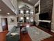 Bright living room featuring hardwood floors, fireplace, comfortable sofa, and open-concept design at 1093 Muirfield Ct, Tarpon Springs, FL 34688