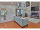 Spacious living area with hardwood floors, stone fireplace, and lots of natural light at 1093 Muirfield Ct, Tarpon Springs, FL 34688