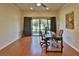 Spacious home office features hardwood floors, natural light, and a ceiling fan at 1093 Muirfield Ct, Tarpon Springs, FL 34688