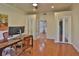 Home office featuring hardwood floors, neutral walls, and double door closet at 1093 Muirfield Ct, Tarpon Springs, FL 34688