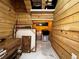 Storage room with wood paneling and tile floor at 1093 Muirfield Ct, Tarpon Springs, FL 34688
