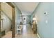 Inviting entryway with tile flooring, neutral walls, console table, and view of the staircase at 1202 7Th Nw Ave, Ruskin, FL 33570