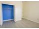 Bright bedroom with tile floors, closet, and ample natural light at 12720 Whitney Meadow Way, Riverview, FL 33578