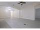 Spacious living room features neutral walls, modern light fixture, and bright white trim at 12720 Whitney Meadow Way, Riverview, FL 33578