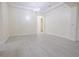 Bright, airy living room with chandelier lighting and easy access to other rooms at 12720 Whitney Meadow Way, Riverview, FL 33578