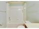 Bright bathroom offers a tub/shower combo with tiled walls and updated fixtures at 13016 Sanctuary Cove Dr # 201, Temple Terrace, FL 33637