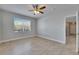 Inviting bedroom featuring tile floors and a large window for ample natural light at 13016 Sanctuary Cove Dr # 201, Temple Terrace, FL 33637