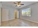Bright bedroom with tile flooring and a window, features a closet for ample storage at 13016 Sanctuary Cove Dr # 201, Temple Terrace, FL 33637