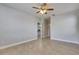Bright, open room featuring tile flooring and ceiling fan; ready for personalization at 13016 Sanctuary Cove Dr # 201, Temple Terrace, FL 33637