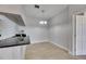 View of the dining area featuring neutral paint, tile flooring, and a modern light fixture at 13016 Sanctuary Cove Dr # 201, Temple Terrace, FL 33637