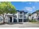 Stylish condo building boasts a modern design, three stories, and convenient garage parking at 13016 Sanctuary Cove Dr # 201, Temple Terrace, FL 33637