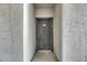 A solid dark gray front door stands within a recessed entryway, promising security and privacy at 13016 Sanctuary Cove Dr # 201, Temple Terrace, FL 33637
