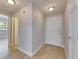 Inviting hallway with tile flooring, leading to rooms filled with natural light at 13016 Sanctuary Cove Dr # 201, Temple Terrace, FL 33637
