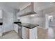 Charming kitchen featuring white cabinets, stainless steel appliances, and tiled flooring at 13016 Sanctuary Cove Dr # 201, Temple Terrace, FL 33637