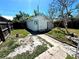 Landscaped backyard with stone path leading up to a shed at 160 16Th Ne Ave, St Petersburg, FL 33704
