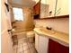 Modest bathroom featuring a combination tub and shower, a tile floor, and vanity at 160 16Th Ne Ave, St Petersburg, FL 33704