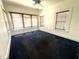 Bright bedroom featuring large windows with carpet flooring at 160 16Th Ne Ave, St Petersburg, FL 33704
