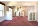 Bright and airy living room featuring stylish built-in cabinets and pink carpet at 160 16Th Ne Ave, St Petersburg, FL 33704