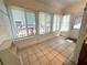 Bright sunroom featuring large windows, tile floors, and lots of natural light at 160 16Th Ne Ave, St Petersburg, FL 33704