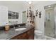 Comfortable bathroom featuring a vanity with marble countertop and a glass-enclosed shower at 17503 Edinburgh Dr, Tampa, FL 33647