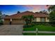 Charming single-story home with a well-manicured lawn, mature landscaping and a three car garage at 17503 Edinburgh Dr, Tampa, FL 33647