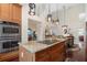 Island kitchen with hardwood floors, stainless appliances, and granite countertops at 17503 Edinburgh Dr, Tampa, FL 33647