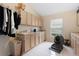 Functional laundry room with ample cabinet space, sink, and built-in features at 17503 Edinburgh Dr, Tampa, FL 33647