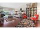 Open living area with hardwood floors, vaulted ceiling, and ample natural light at 17503 Edinburgh Dr, Tampa, FL 33647